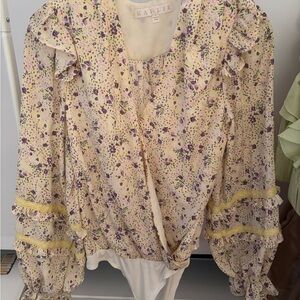 Long sleeve body suit blouse with fun pattern in size small